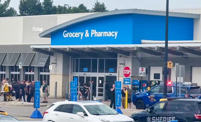 Emergency personnel stand outside a Walmart store, where a stabbing incident occurred, in Traverse City, Michigan, U.S. July 26, 2025, in this screen grab taken from a social media video.