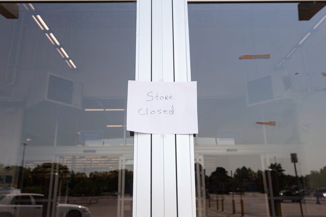 A “store closed” sign is seen on a door at Walmart in Traverse City, following an incident that injured 11 people the previous weekend, on Monday, July 28, 2025.